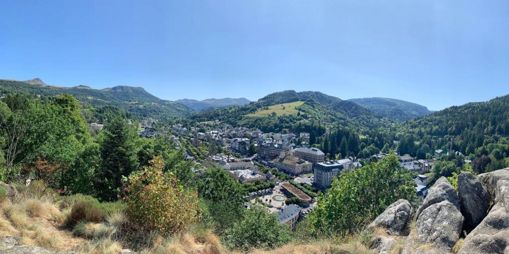 a view of a city from a mountain at Tout confort T2 in La Bourboule
