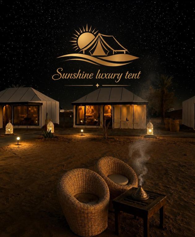 a luxury tent in the desert at night at Sunshine luxury tent in Merzouga