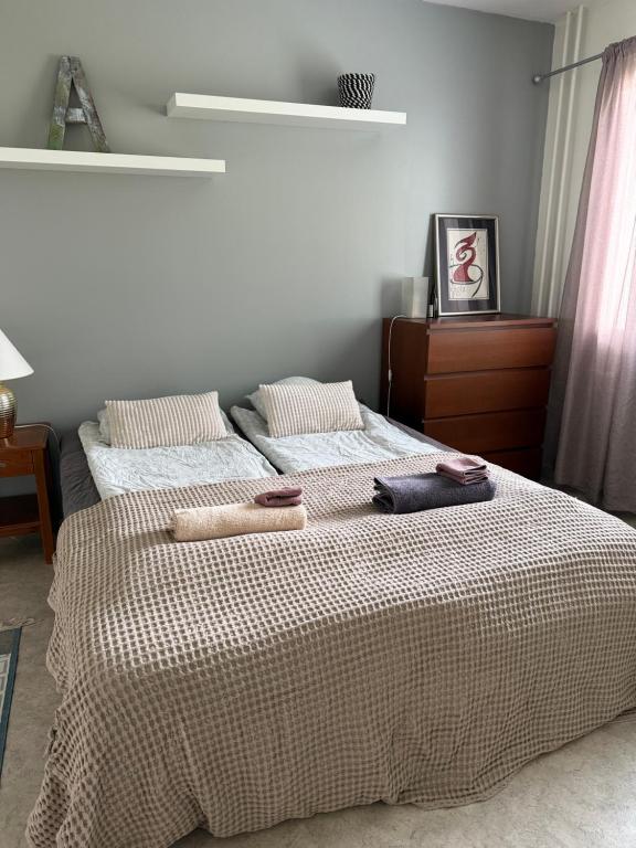 a bedroom with two beds with towels on them at Mäyränkadun kolmio in Kokkola