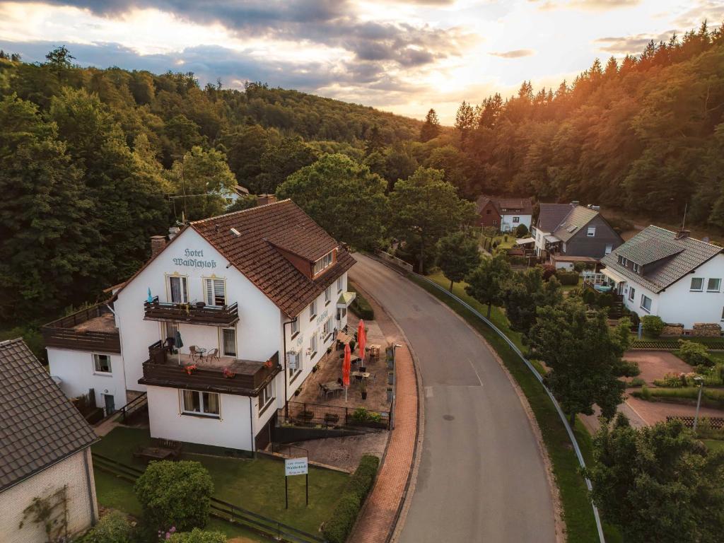 an overhead view of a house on a road at Pension Waldschloß in Holzminden