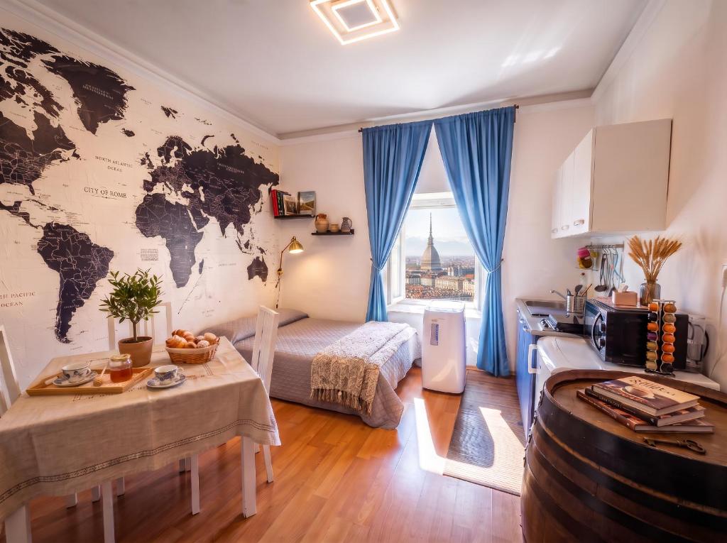 a room with a map of the world on the wall at SWEET APT Piazza Statuto 9 Deluxe NEL PIENO CENTRO DI TORINO in Turin