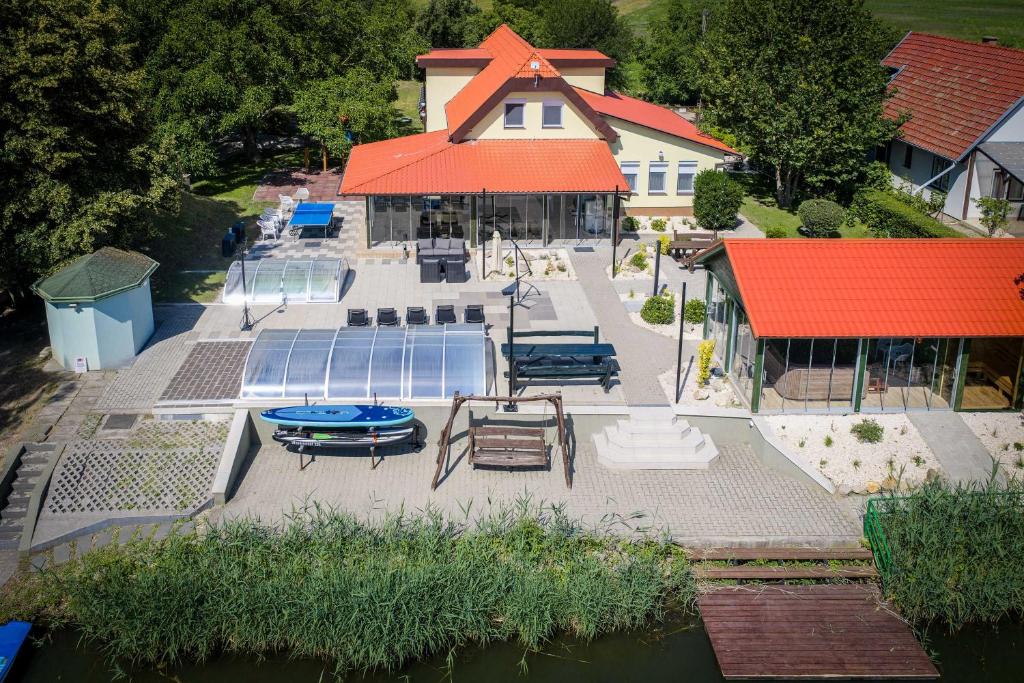 an aerial view of a house with a swimming pool at Diófa Vendégház in Békésszentandrás