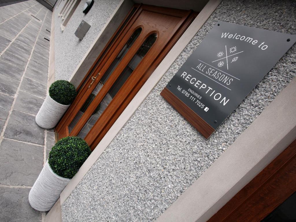 a sign on the door of a restaurant at All Seasons B&B in Portrush