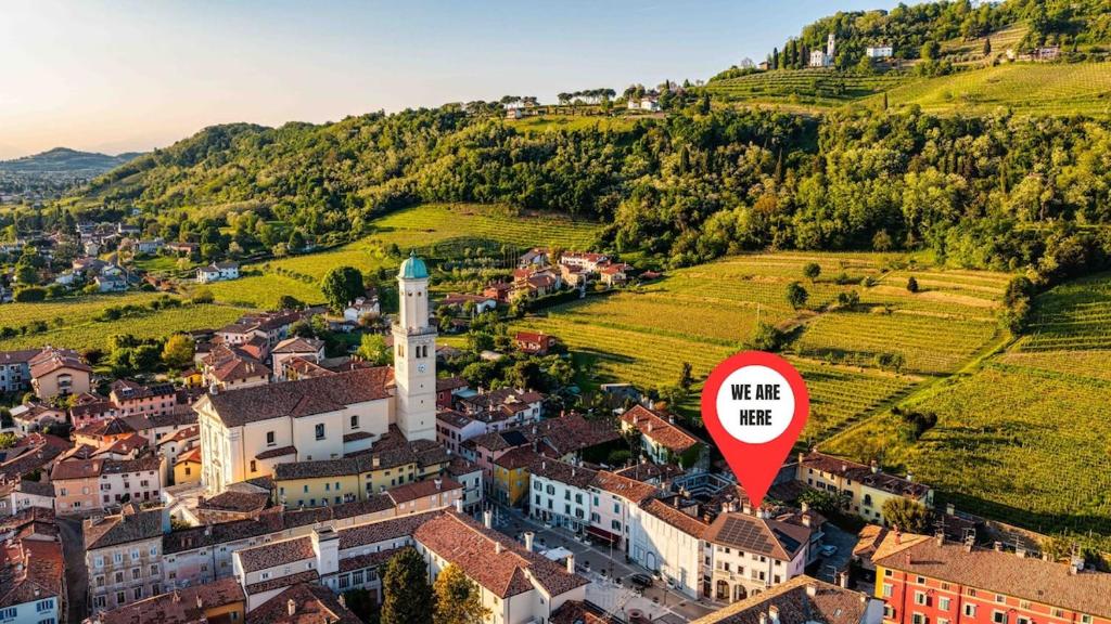 an aerial view of a town with a red sign at Casa Sgubin in Cormòns