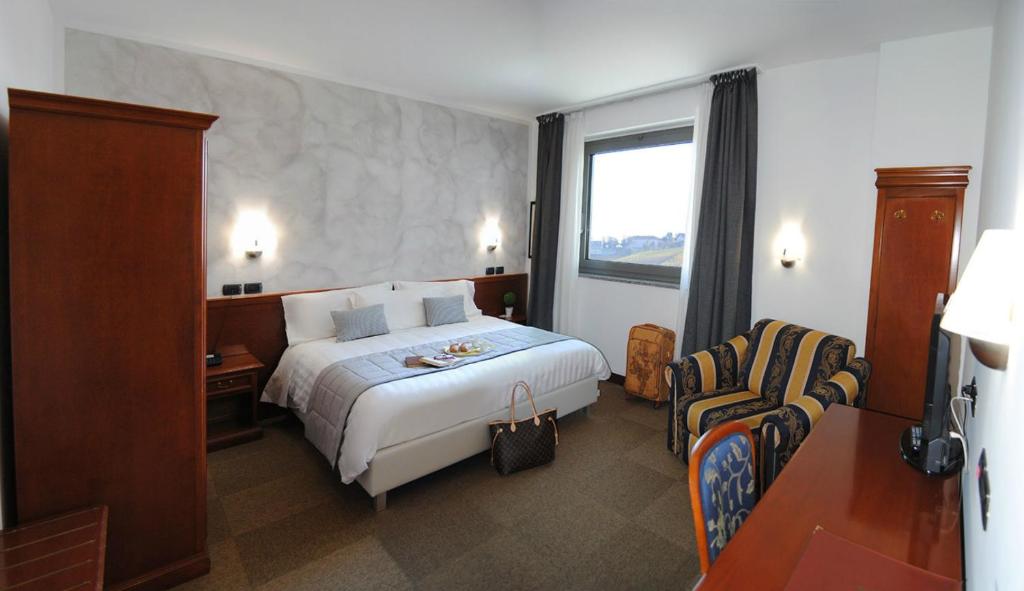 Postel nebo postele na pokoji v ubytování Hotel Medea