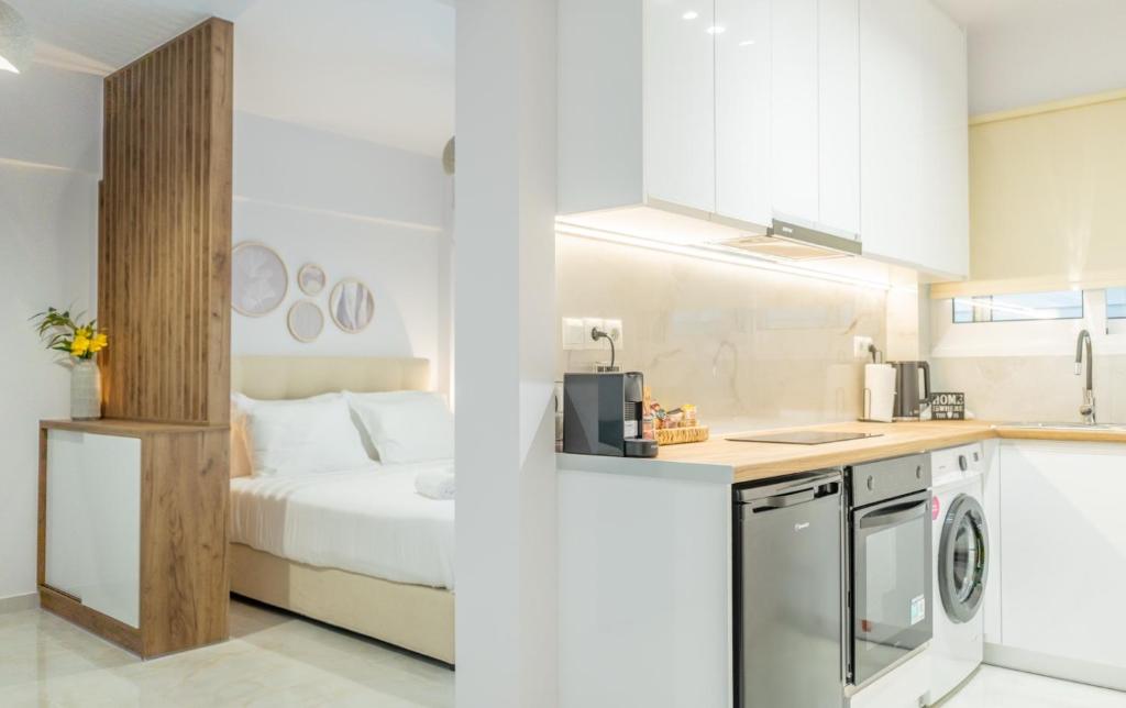 a kitchen and a bedroom with a bed at Rafaela Sea Gem in Loutraki