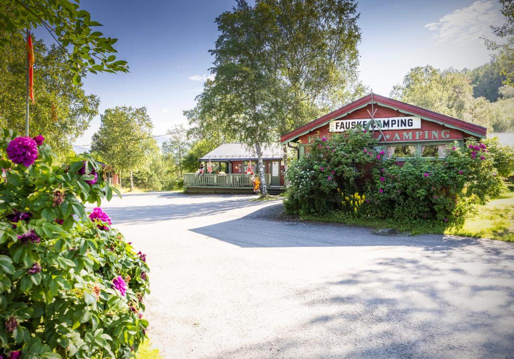 a building with a sign that reads hope awakening awakening at Fauske Camping & Motel in Fauske
