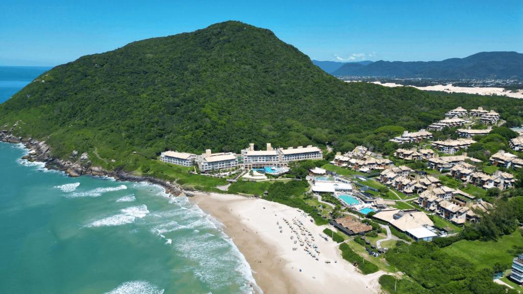 an aerial view of a resort on a beach at Costao do Santinho Resort All Inclusive in Florianópolis