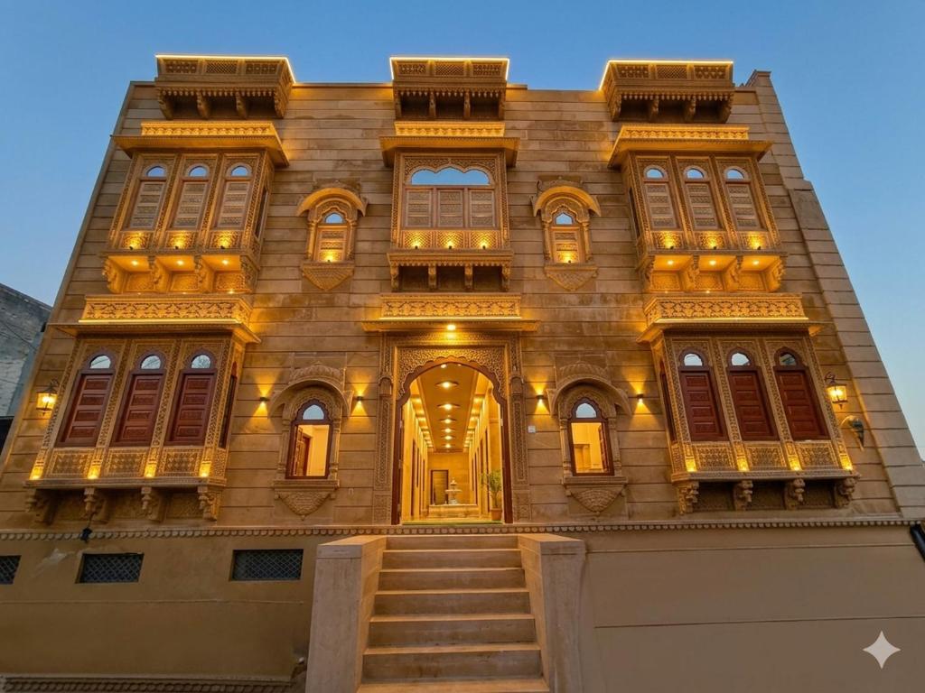 a building with a staircase in front of it at Hanu Guest house in Jaisalmer