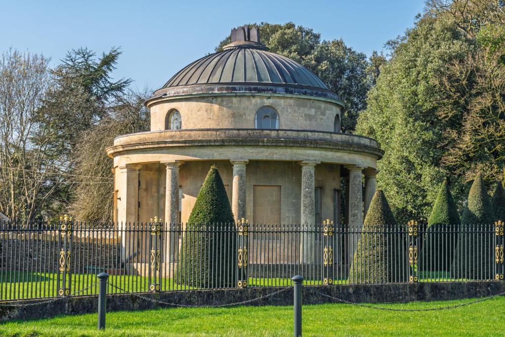 a gazebo behind a fence in a park at Bath Lodge in Bristol