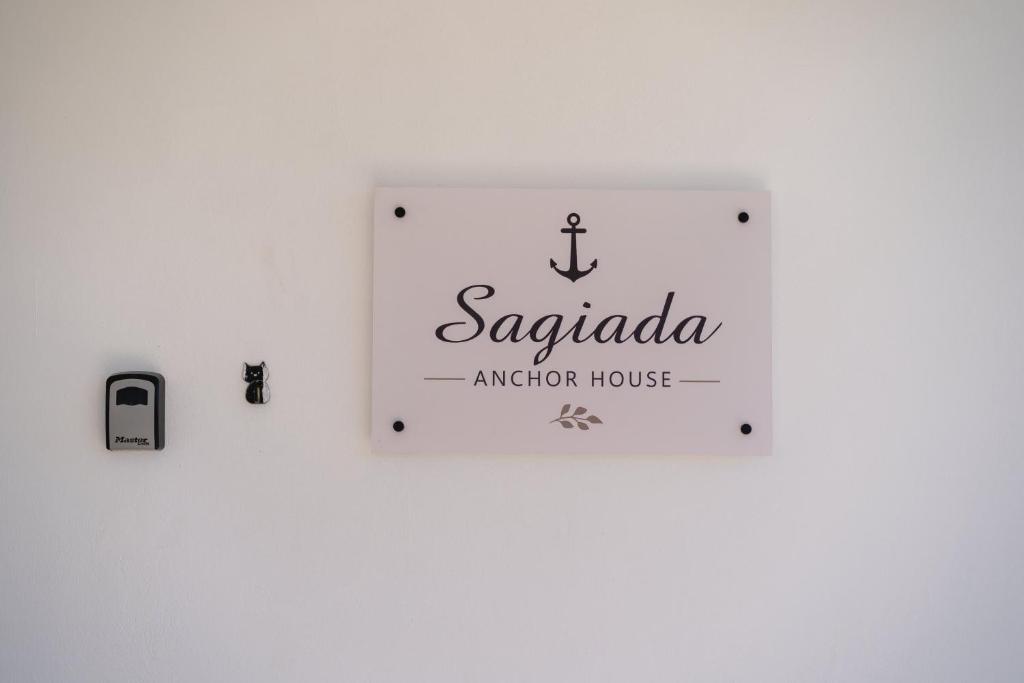 a sign for a zapoda automation house on a wall at Sagiada Anchor House in Sagiada