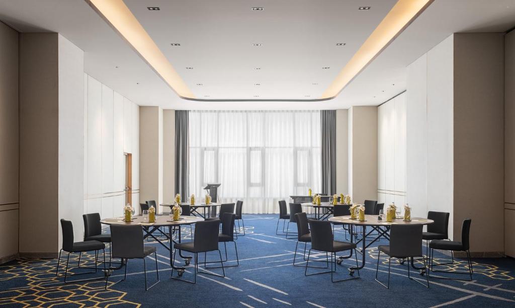 A conference room arranged for seated meetings and presentations.