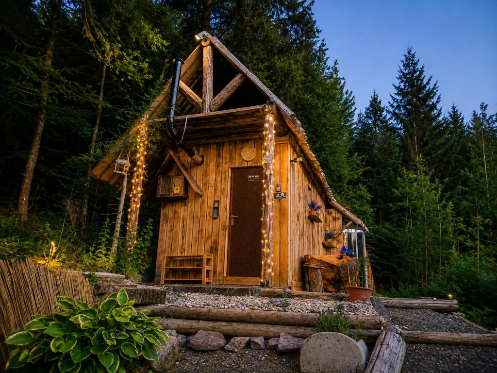 a small cabin in the woods with a roof at Mornov raj in Vuzenica