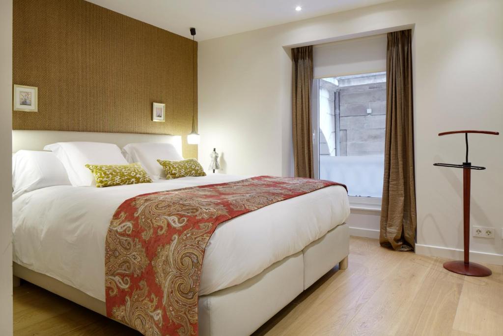 Posteľ alebo postele v izbe v ubytovaní Hika Mika Apartment by FeelFree Rentals