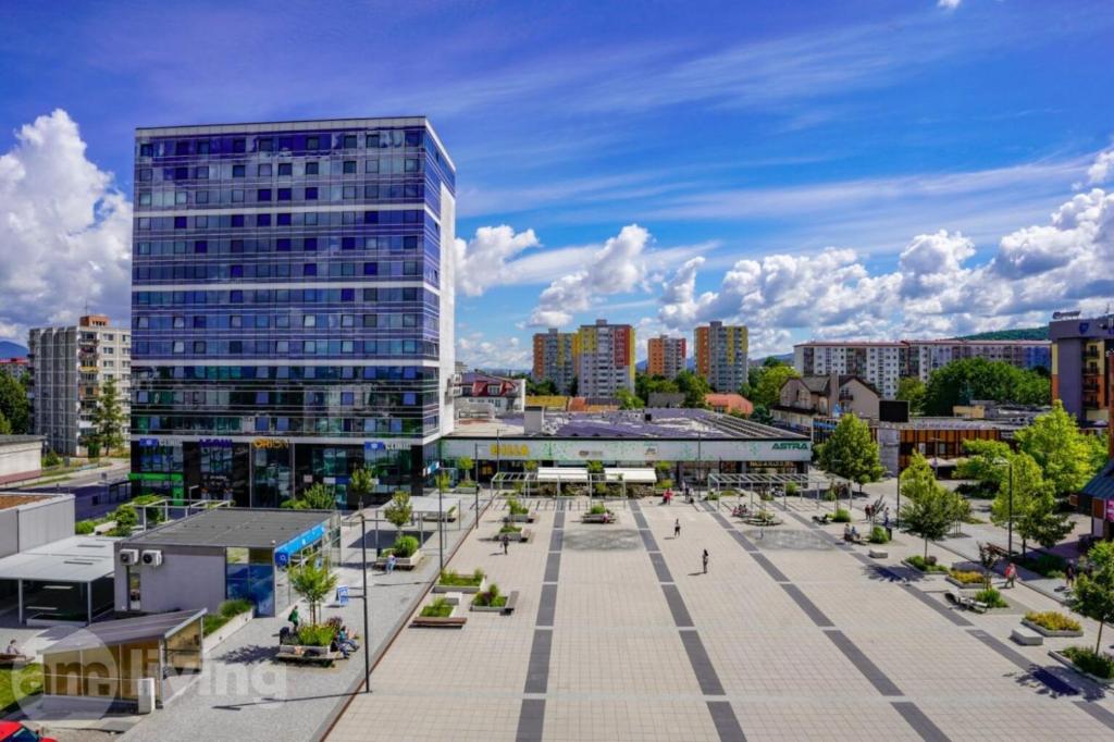 a view of a city with a tall building at Apartment Centrum Orion in Dubnica nad Váhom