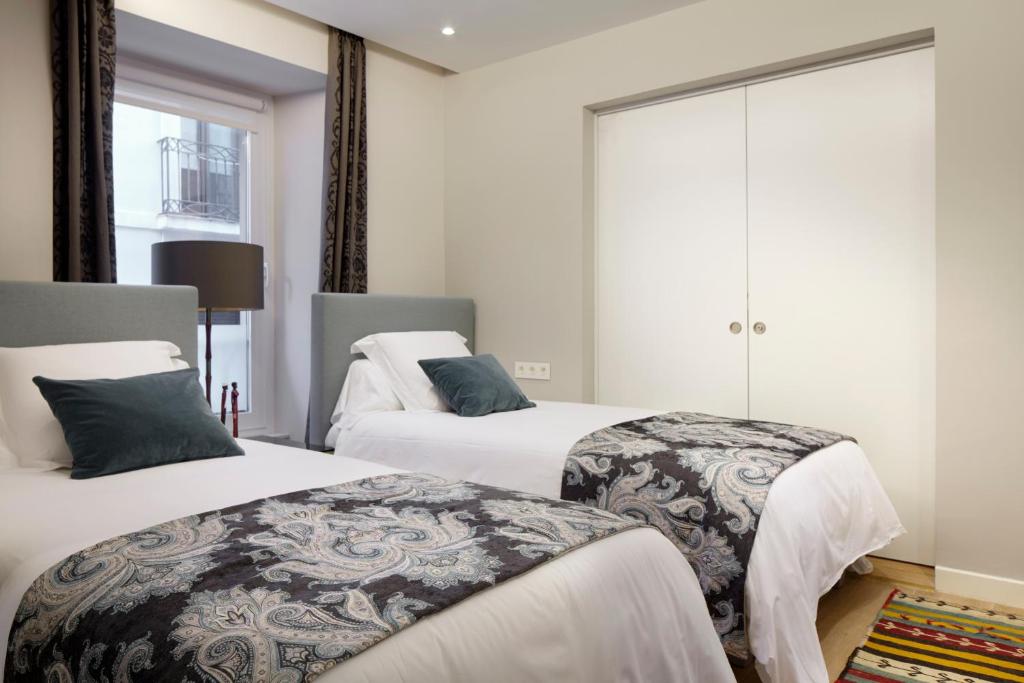 Posteľ alebo postele v izbe v ubytovaní Hika Mika Apartment by FeelFree Rentals