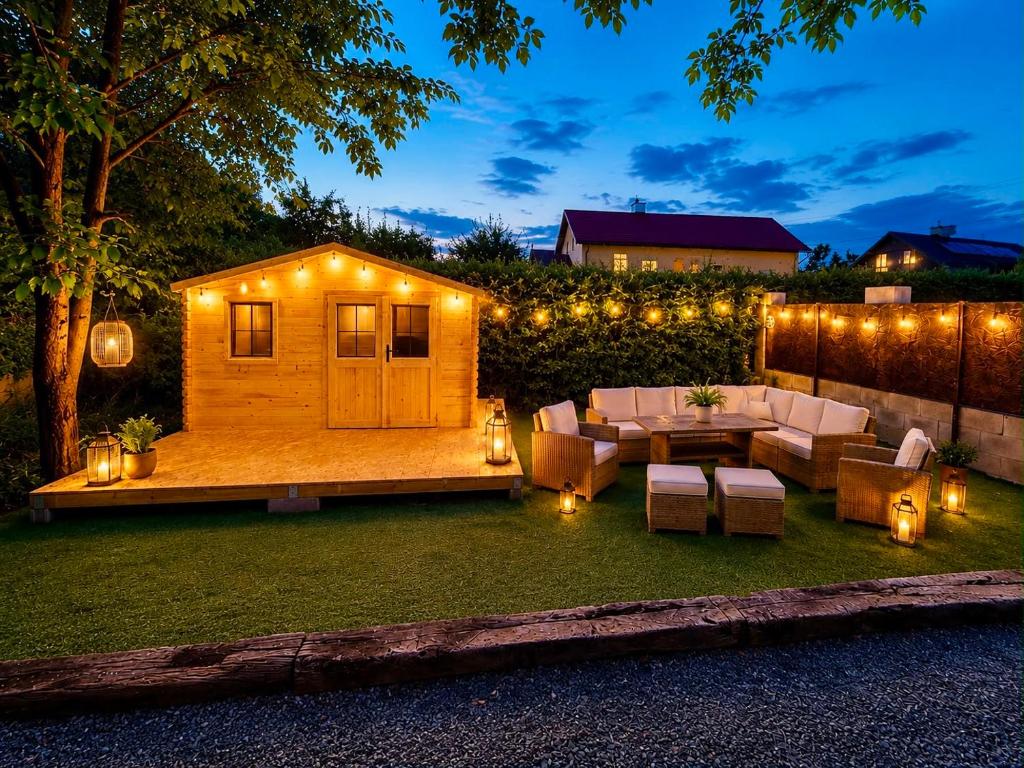 a backyard with a tiny house with lights at Glamping 68 - Summer cottage in Kámen