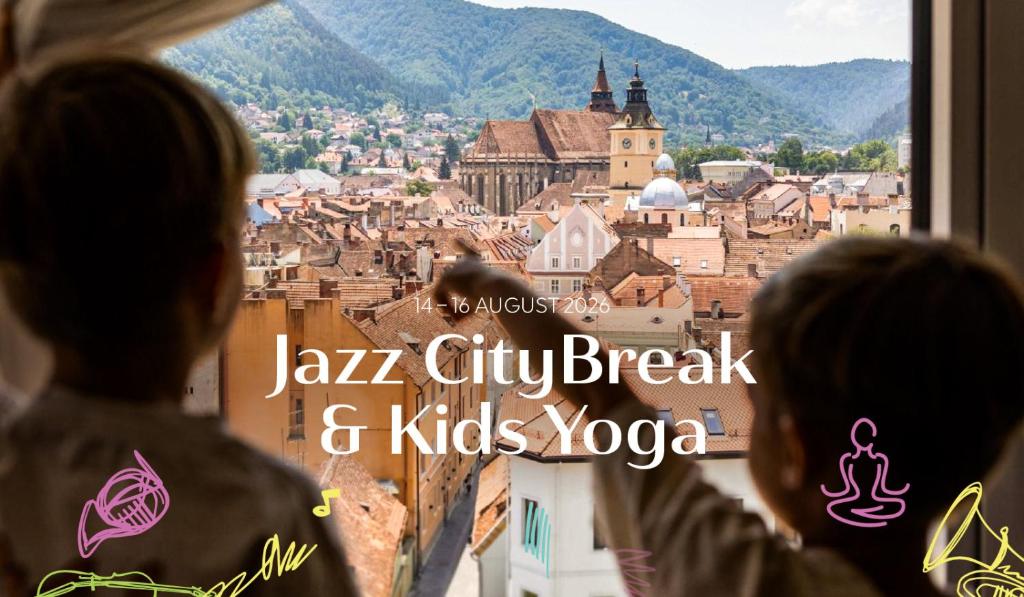 two people looking out a window at a city break and kids yoga at Hotel Aro Palace in Braşov