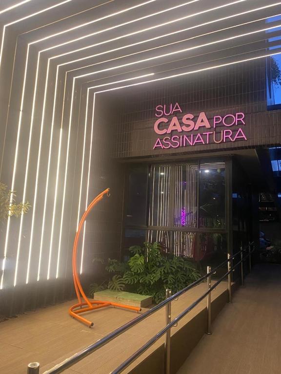 a building with a sign that says szu casino for australiana at FLAT Executivo próx Consulado Americano in Recife