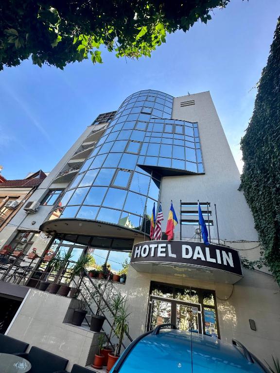 a hotel building with a hotel claim sign on it at Dallin Center Hotel in Bucharest