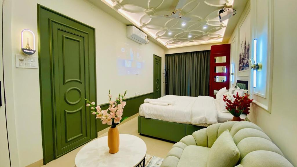a hospital room with a bed and a couch at StayMooddy in Indore
