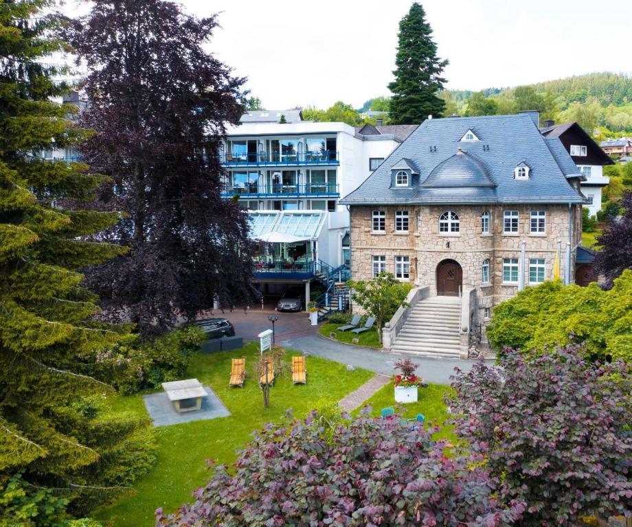 an aerial view of a building with a park at Vis á Vis Parkhotel in Willingen