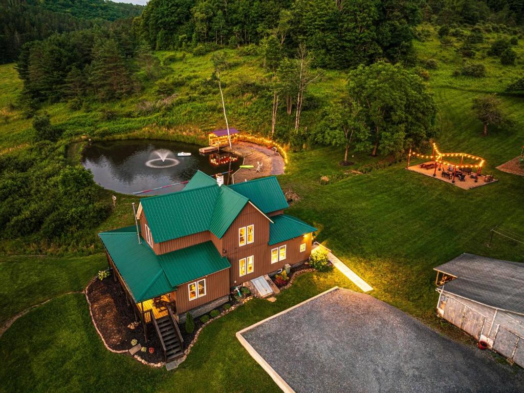 an aerial view of a house with a green roof at The Old Homestead in Roulette
