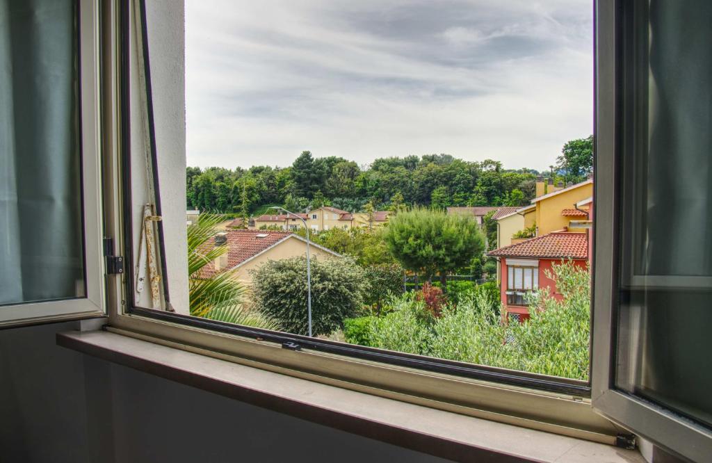 a window with a view of a city at Casa Alice in Numana