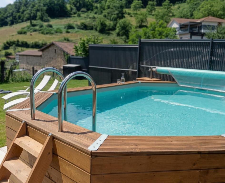 a swimming pool with a wooden deck and a swimming poolvisor at Le Nolan in Cublize