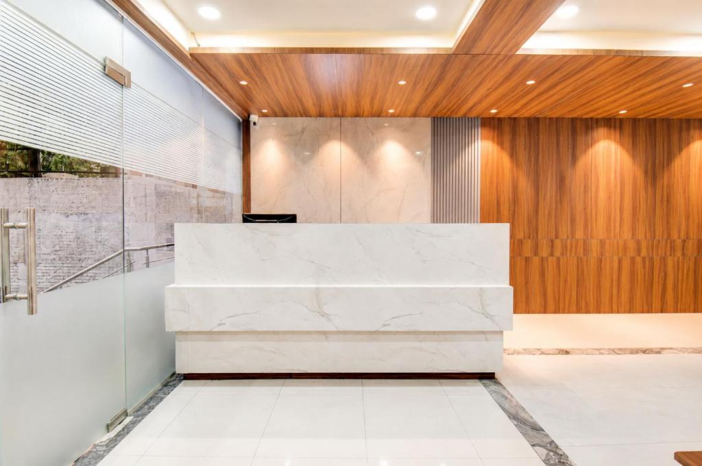 an office with a marble desk in a lobby at Hotel The Lavendra Heritage in Patna