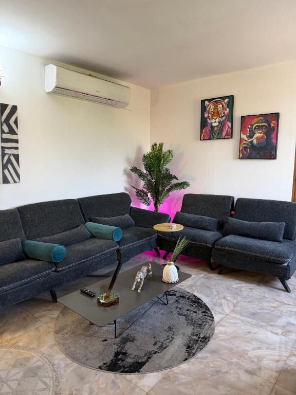 a living room with a couch and a table at شركة دار المعرفة للعقار in Baghdād