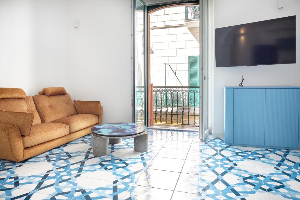 a living room with a couch and a table at Maison Blu Royal in Amalfi
