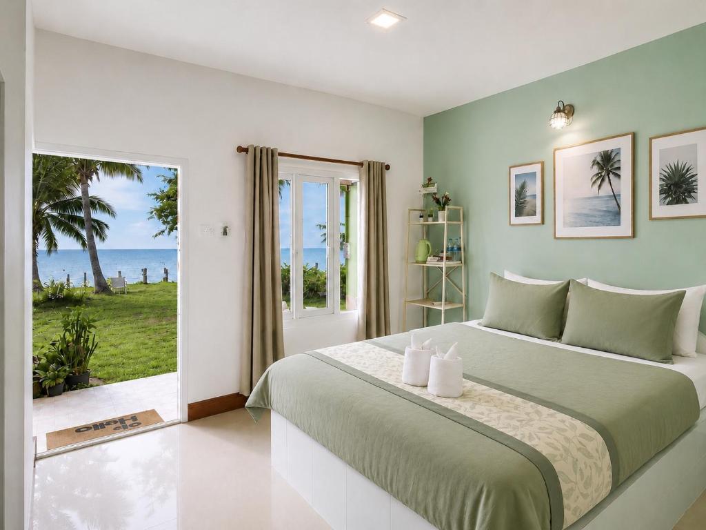 a bedroom with a bed with a view of the ocean at Ava Beach Pakbara in Ban Pak Ba Ra