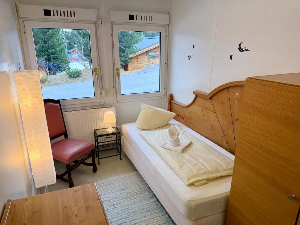 a small room with a bed and a chair at Weaky what you want in Ugine