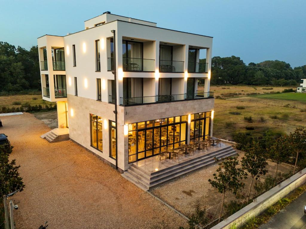 an aerial view of a house with lights at Velmare Inn in Ulcinj