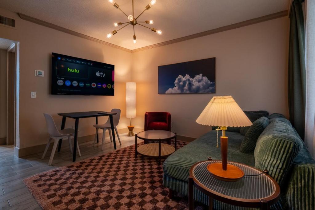a living room with a couch and a table at Emerald at Belleair Beach Club in Clearwater Beach
