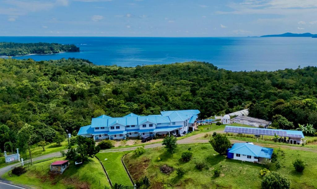 an aerial view of a house with blue roofs at Casa Blanca Inn in Torio