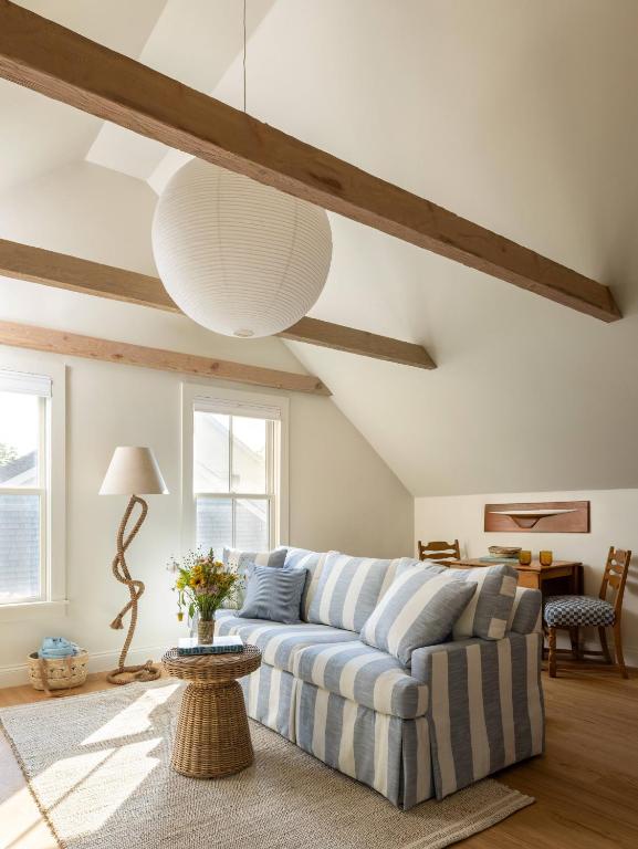 a living room with a couch and a table at The Lightkeeper’s Inn in Edgartown