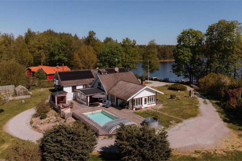 an aerial view of a house with a swimming pool at Villa Waldsee in Vissefjärda