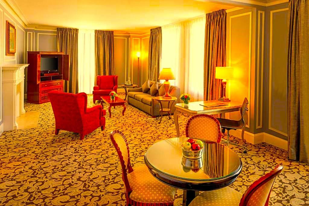a large hotel room with a living room at Hotel Bhanuka Palace in Dhanbād