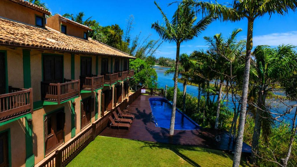 an aerial view of a resort with a swimming pool at Pousada Engenho da Lagoa in Garopaba