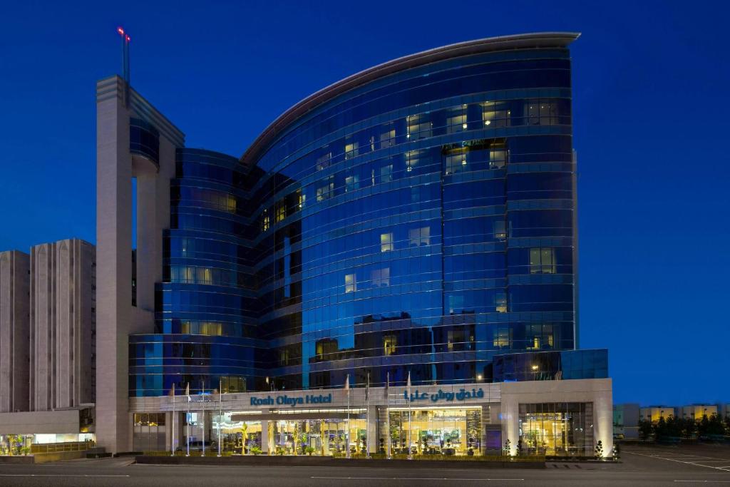 a large blue building with a lot of windows at Rosh Olaya in Riyadh