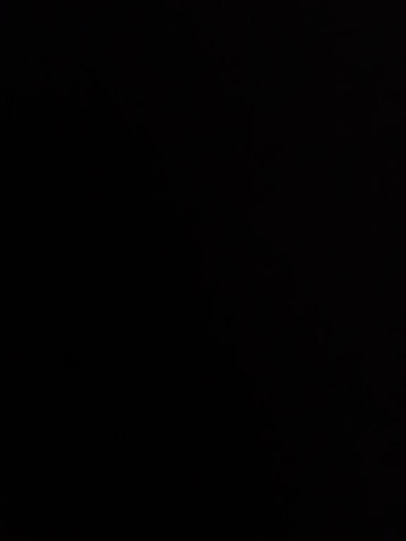 a dark room with a black background at وادي رم سكن in Wadi Rum