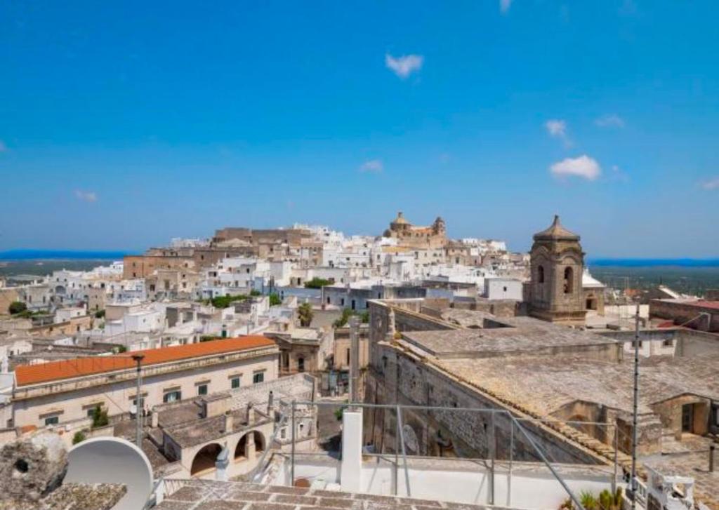 a view of a city from the roofs of buildings at Casa Ulivo in Ostuni
