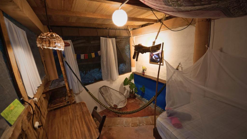 an overhead view of a room with a hammock at Mariposa - Casa Corazon Mazunte in Mazunte