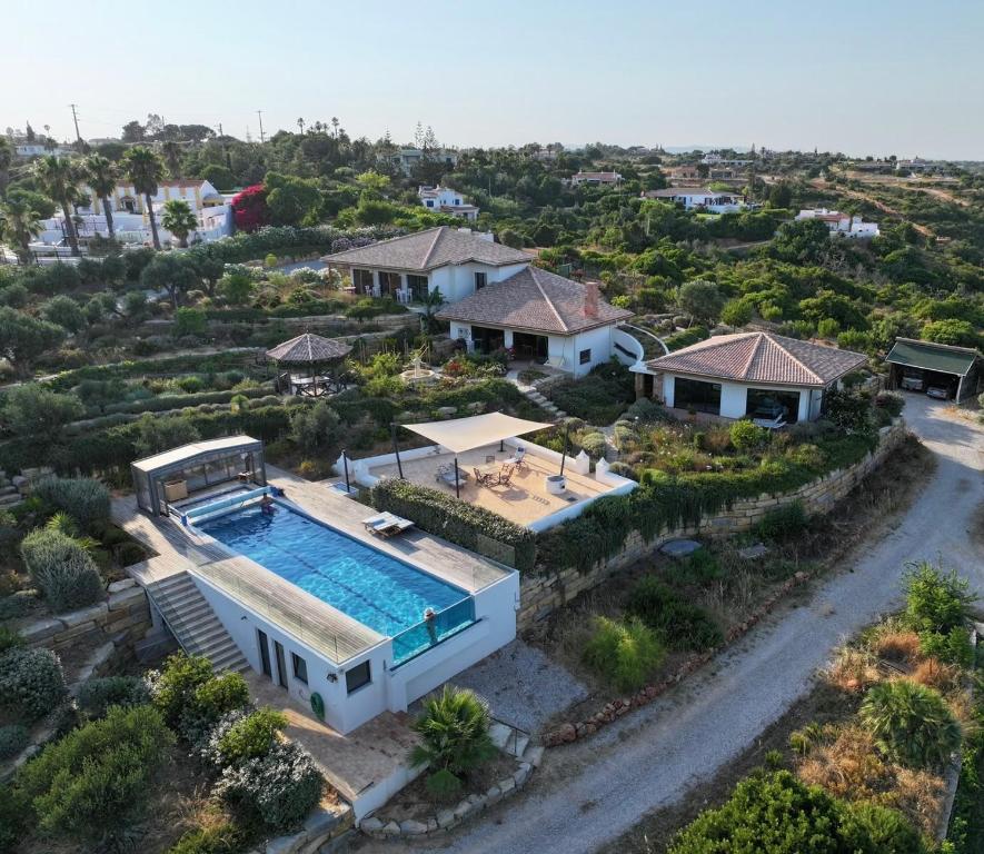 an aerial view of a house with a swimming pool at Casa Poupa in Lagoa