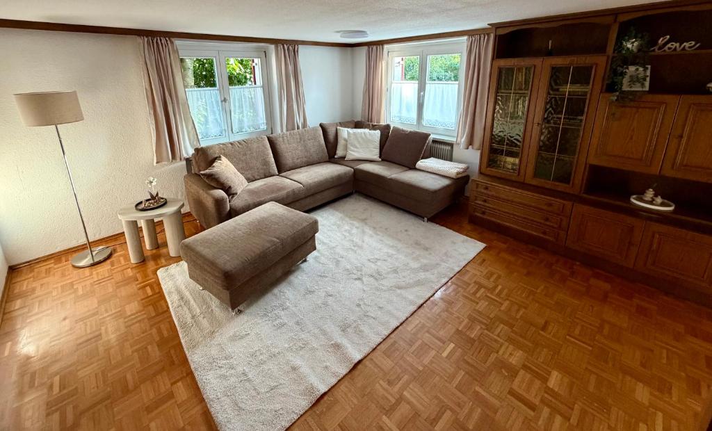 a living room with a couch and a rug at Ferienwohnung Lauterach in Lauterach