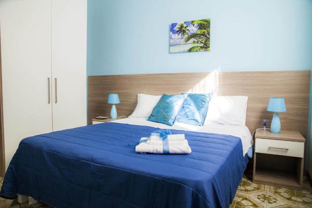 Postel nebo postele na pokoji v ubytování B&B Giosy