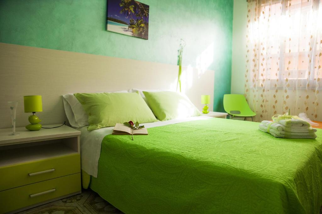 Postel nebo postele na pokoji v ubytování B&B Giosy