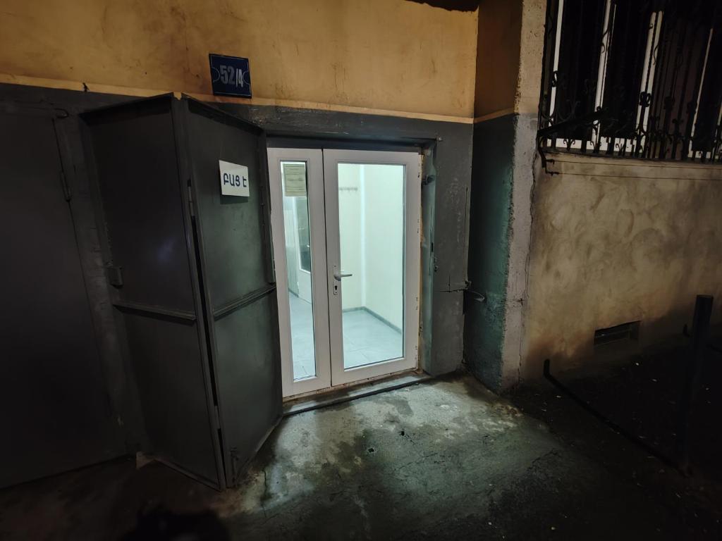 an empty room with a door and a window at MG guest house in Geghanist